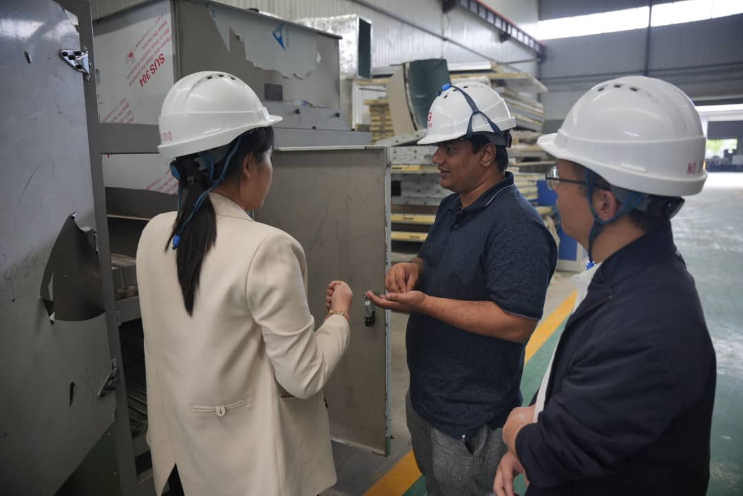 Inspecting machinery on the factory floor